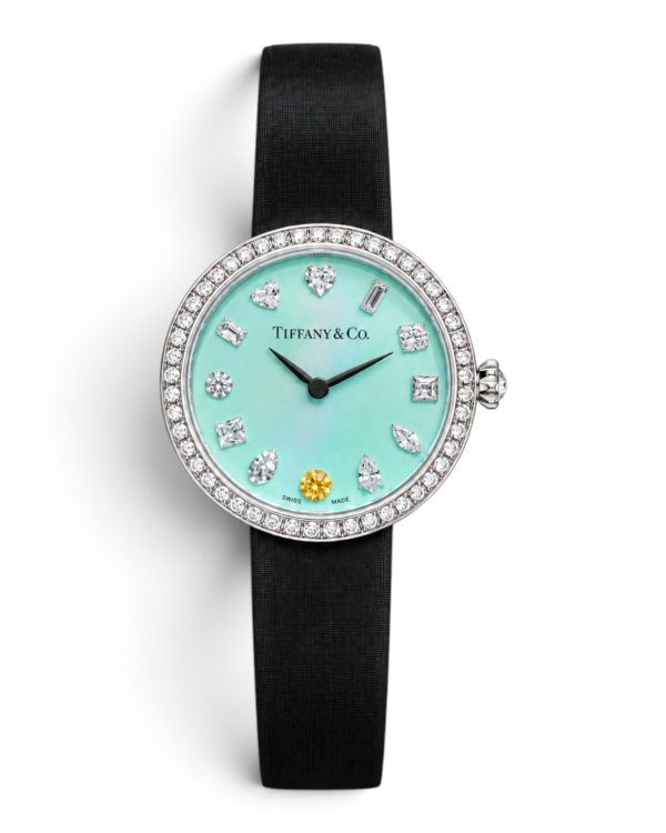 AAB00F45-210E-4C5E-9D51-A5C1A97F19D1 Tiffany & Co. Eternity Celeste Liso: esfera celeste claro lisa con piedras brillantes y una piedra amarilla a las 6, bisel plateado con brillos