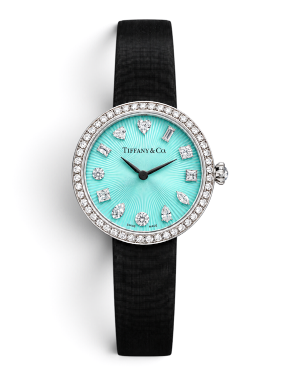 6B8AFCA1-C64C-49A0-8F11-19EA0B69A27F Tiffany & Co. Eternity Celeste Rayos: esfera celeste con líneas que salen del centro, piedras brillantes de formas variadas y bisel con brillos